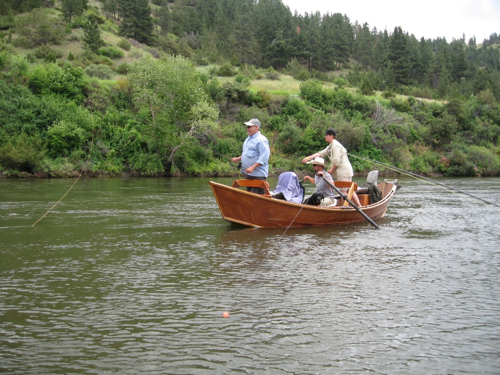 Classic wood drift boat fly fishing. Clear Creek Outfitters